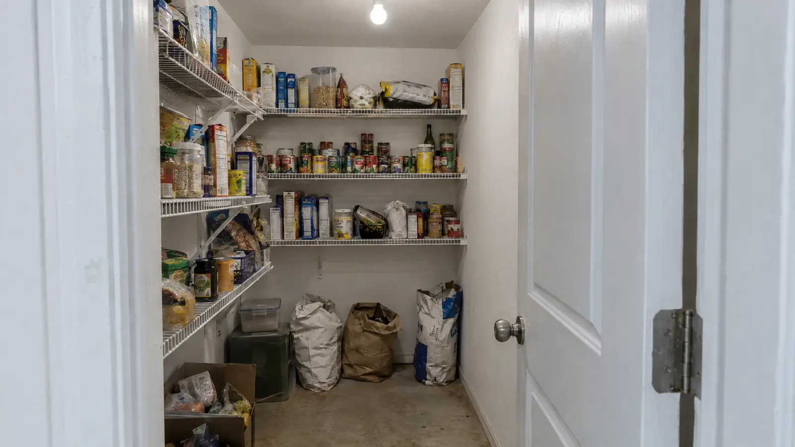 Before: a kitchen pantry with crowded wire shelves