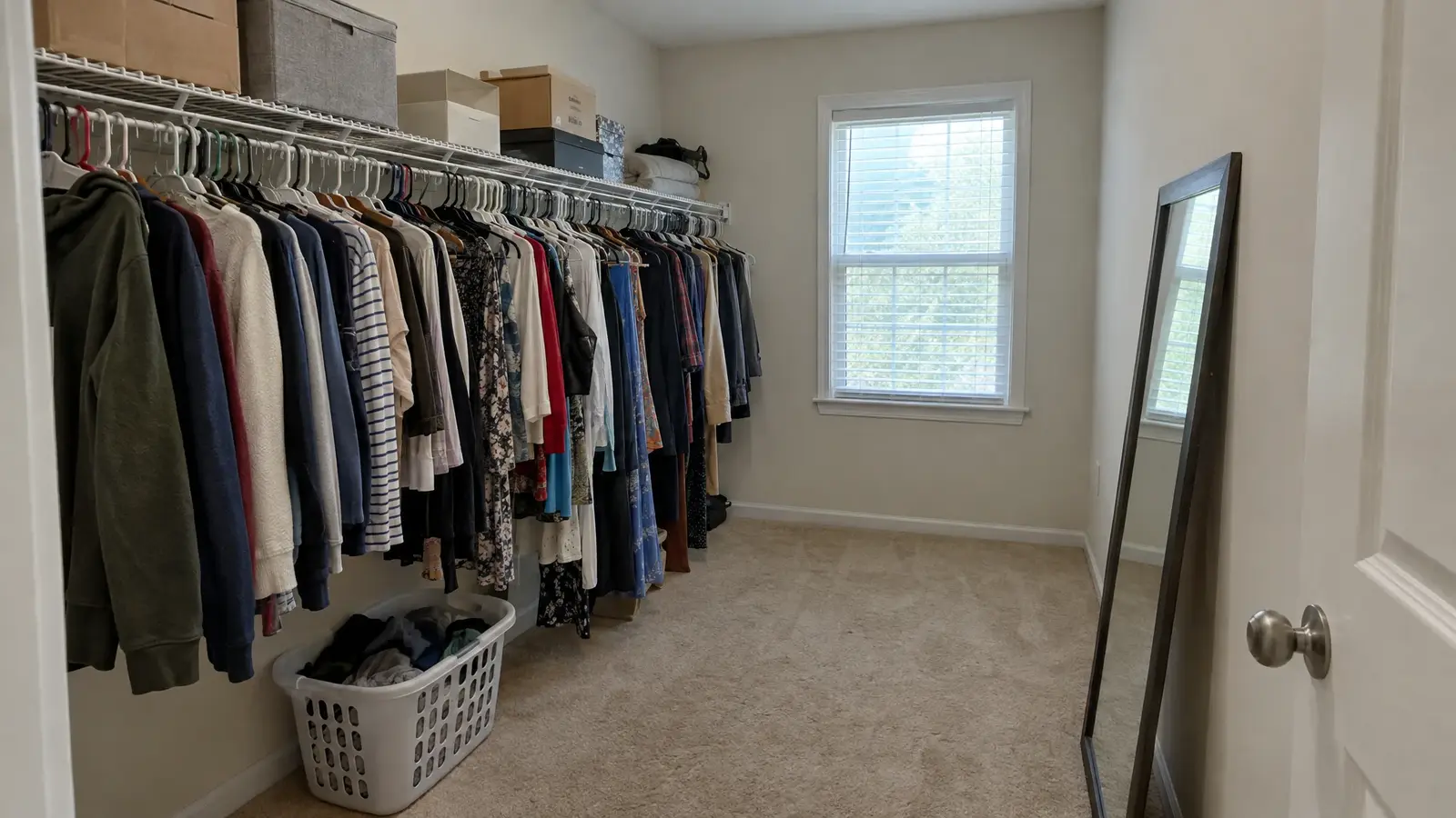 Before: a primary suite closet with a cluttered, underused closet