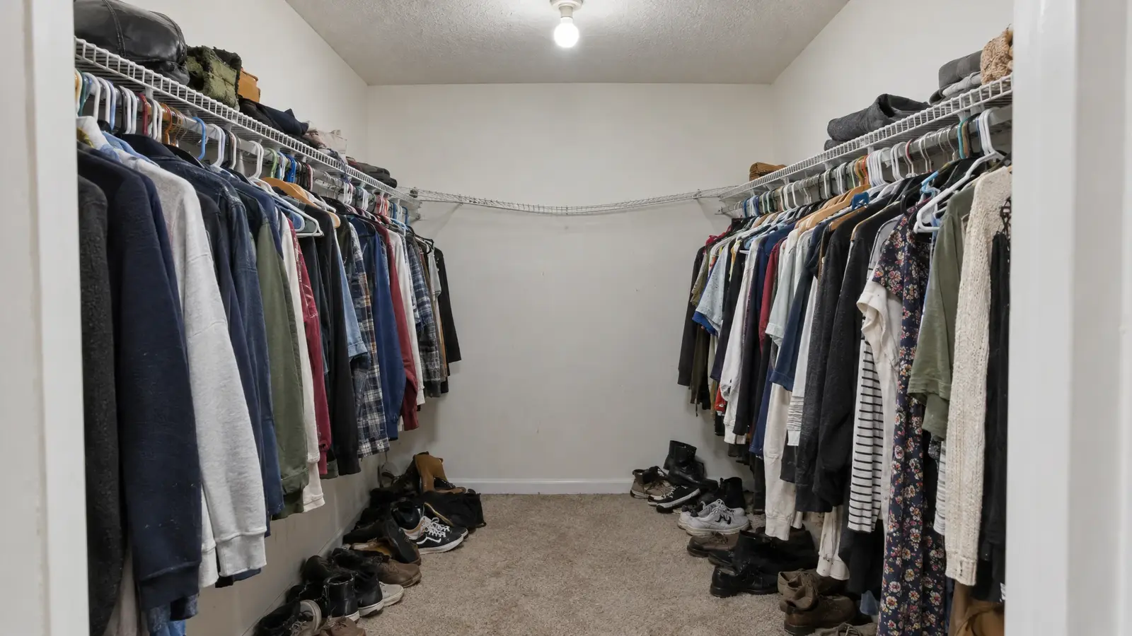 Before: a walk-in closet with bare walls with a single rod and shelf
